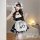 A woman wearing a black and white maid dress with ruffles, featuring a bow apron and cat paw design, perfect for cosplay or a...