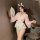 A woman poses elegantly in a pink kimono-style lingerie set, featuring delicate floral patterns and bunny ears headband. the ...