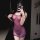 Woman wearing kouni sheer purple lingerie set, backless tight-fit costume for nightclub and bedroom play.