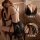 Woman wearing black lace babydoll sleep dress with sheer mesh and slit design, romantic lingerie set for women.