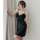 A woman poses elegantly in a black lace babydoll sleep dress, featuring sheer fabric and delicate lace details, perfect for r...