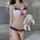 A woman models a lace bikini set featuring navy blue accents and red bows, holding a plush rabbit accessory. ideal for seduct...