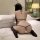 Woman wearing premium lace bodysuit set, sheer open-crotch thong bra with black straps and cat ears, kneeling on bed.