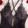 Luxury lace bodysuit featuring sheer elegant design with intricate floral patterns and crisscross straps, perfect for women s...
