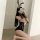 Woman in black lace bunny girl bodysuit with ears, posing seductively for nightclub or role play — plus size friendly.