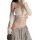 Woman wearing white lace cami bodysuit with bind-up front, paired with gray sweatpants and cream cardigan.