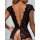 Woman wearing black lace deep v-back sleepwear with sheer cutouts and floral trim, showcasing elegant erotic lingerie design.