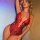 Sexy red lace bodysuit with halter neck design, sheer open-crotch style, perfect for womens sleepwear.
