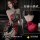 Woman modeling red and black lace halter sleepwear set with sheer romantic design, featuring a backless silhouette and elegan...