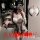 Woman wearing white lace maid costume with black garter straps, holding phone for mirror selfie in bedroom setting.