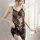 Woman wearing black lace mesh babydoll sleep set with sheer floral embroidery, elegant and sexy lounge wear.