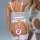 Woman wearing white lace mesh bodysuit with corset-style shapewear and attached garter belt holding stockings.