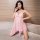 Woman modeling pink lace mesh lingerie set, featuring sheer nightdress with delicate straps and seductive design for plus siz...