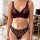 Woman modeling a luxury lace mesh lingerie set with a red and black push-up bra and matching high-waist panties.