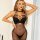 Woman wearing black lace polka dot bodysuit with cutout details, plus size sensual lingerie for intimate wear.