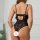 Woman wearing black lace pure-temptation bodysuit, backless sexy lingerie with no-remove design, elegant lace detailing.