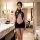 Woman in luxury lace bodysuit dress, pure temptation qqny-style seductive sleepwear & lingerie set, elegant hotel setting.