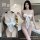Luxury lace lingerie set featuring a seductive three-piece bra and matching sleepwear with elegant bow detail.