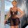 Woman modeling black lace cami and sheer short nightdress, elegant plus size sleepwear set in style bedroom lingerie.