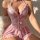 Pink lace sheer backless two-piece set with camisole and skirt, featuring delicate bows and floral embroidery for a sexy euro...