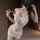 Woman wearing white lace sheer bodycon nightdress set with embroidered floral details, mesh babydoll lounge style.