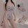 Woman wearing a lace sheer bodysuit set with floral embroidery, featuring a modest yet sexy design.