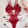 Red lace sheer bodysuit for women, featuring intricate floral patterns and delicate straps, styled with soft pink flowers and...