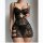 Woman wearing black lace sheer sleepwear set with camisole and slip nightgown, featuring floral patterns and cut-out details.