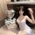 Woman in white lace sheer sleep dress with blue bows, posing beside heart balloon and roses. pure & tempting summer babydoll ...