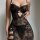Woman wearing black lace sheer sleepwear set with adjustable straps, featuring erotic lingerie nightgown design in -style.