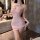 Woman wearing a pink luxury lace sleep dress with sheer mesh bodycon design and floral halter neck detail.