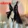 Black sheer lace slip dress with ruffles and built-in support, displayed on mannequin — luxury sensual nightgown for women.