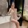 Woman in luxury lace sleepwear taking mirror selfie, showcasing sheer satin slip dress with push-up support and elegant embel...