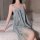 Woman wearing a delicate lace teddy sleep set, featuring a sexy plus size chemise with garter belt details, elegantly posed o...