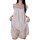 Woman wearing a white lace teddy sleep set with floral patterns, featuring a chemise and garter belt for plus size women.