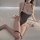 Sexy open-crotch lace bodysuit with ruffled details, perfect sleepwear set for women.
