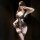 Woman in black lace bustier lingerie set with sheer panels, thigh-high stockings, and eye mask — elegant & sensual.