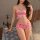 A woman models a pink lace-trimmed sexy sleep dress featuring heart patterns, perfect for elegant bedroom wear.