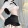 Woman modeling lemon story seductive air hostess costume with white cropped top and black skintight pencil skirt.