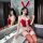 Sexy red bunny costume with lace-up bodice and thigh-high stockings, perfect for festive occasions.