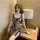 A woman poses elegantly in a leopard print lace chemise set, featuring sheer sleepwear and intimate lingerie designed for wom...
