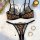 Leopard print lingerie set with sheer mesh bra and panty, accented with black lace trim, styled with jewelry and candle.