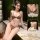 Woman modeling leopard print halter lingerie set with tie-back detail, showcasing comfortable and sexy sleepwear design.
