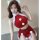 Sexy red velvet santa-themed lingerie set featuring a halter top with pom-poms and a mini skirt with lace trim and adjustable...