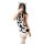 A woman poses with a cow-themed outfit featuring a sleeveless dress adorned with black spots, paired with white knee-high soc...