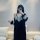 A woman models a black lace gold velvet embroidered long sleep dress with backless design and tie belt robe set, perfect for ...