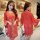 Woman modeling red lace sheer bridal lingerie set with satin goddess robe, featuring long sleeves and romantic design.