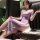 Woman wearing lavender lace split long dress lingerie set, sheer sensual sleepwear for summer evenings.