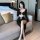 Woman wearing liaru sexy lace bodysuit with long sleeves and high slit, featuring sheer mesh bodycon design in a modern bedro...