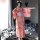 A woman models a pink floral japanese kimono-style cat-themed sleepwear set, featuring long sheer fabric and elegant design, ...
